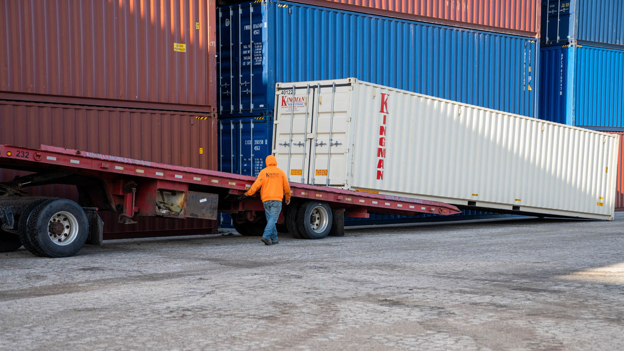 40 foot container being loaded onto a tractor trailer